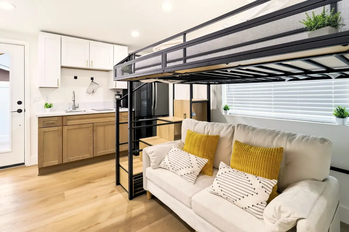 Bay Ho garage conversion — living area with sleeping loft
