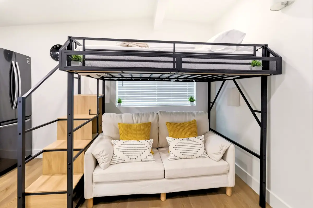 Bay Ho garage conversion — sleeping loft over sofa