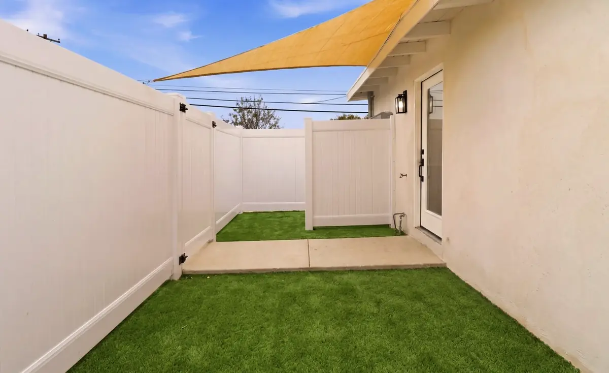 Bay Ho garage conversion — private turf patio