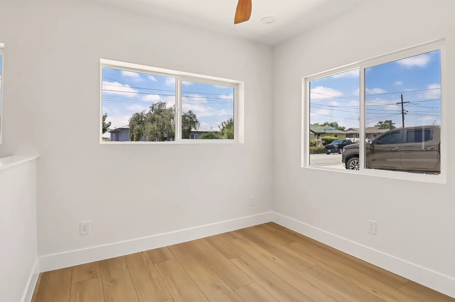 49th Street garage conversion — bedroom with dual windows