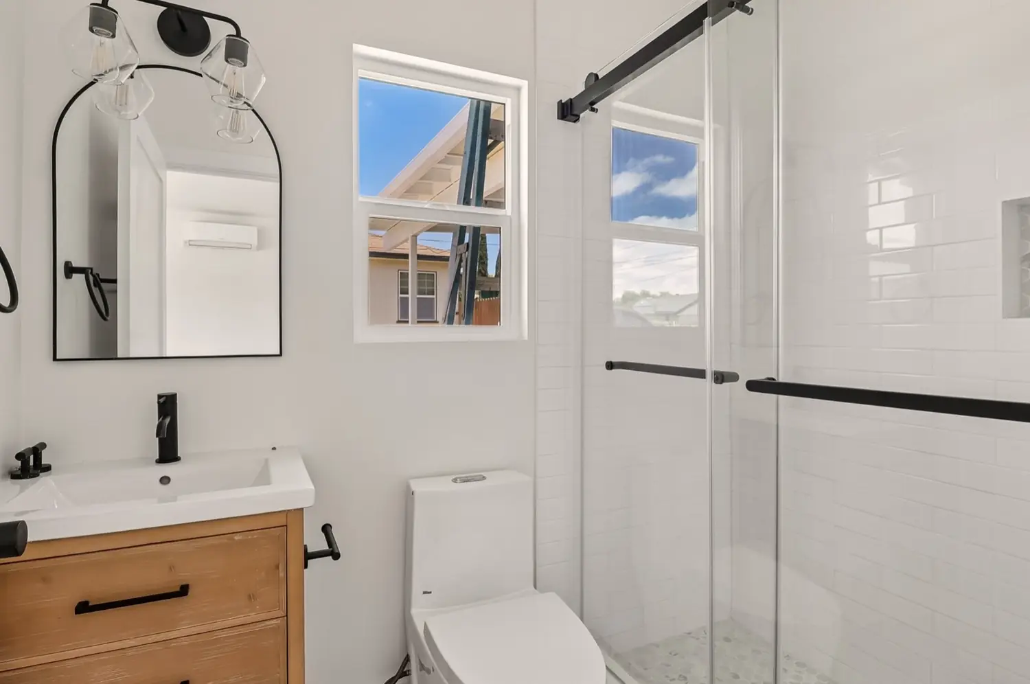 49th Street garage conversion — bathroom with glass shower