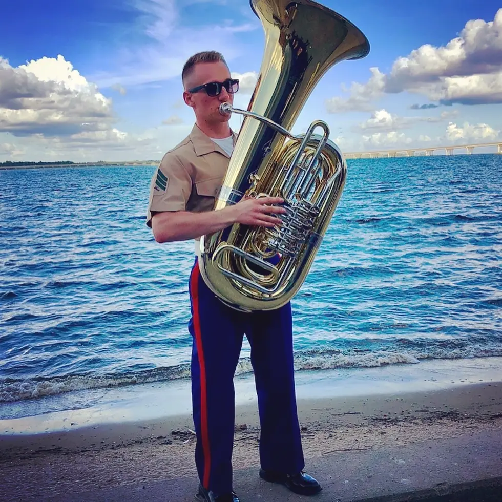 Brian playing tuba in his Marine dress uniform