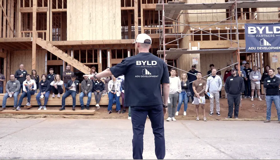 Brian addressing a group at a Byld Partners build